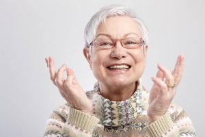 An old woman with high-quality dentures